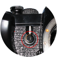 Pentax LX - Кнопка на многофункциональном рычаге на передней панели камеры